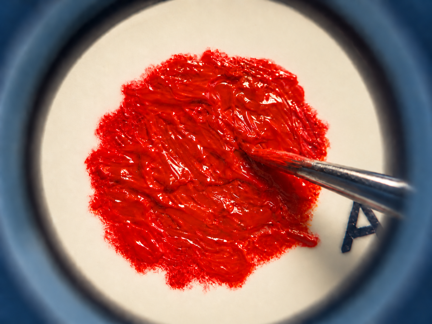 The Outlier — macro close-up of the red painted detail during the hand-painting process